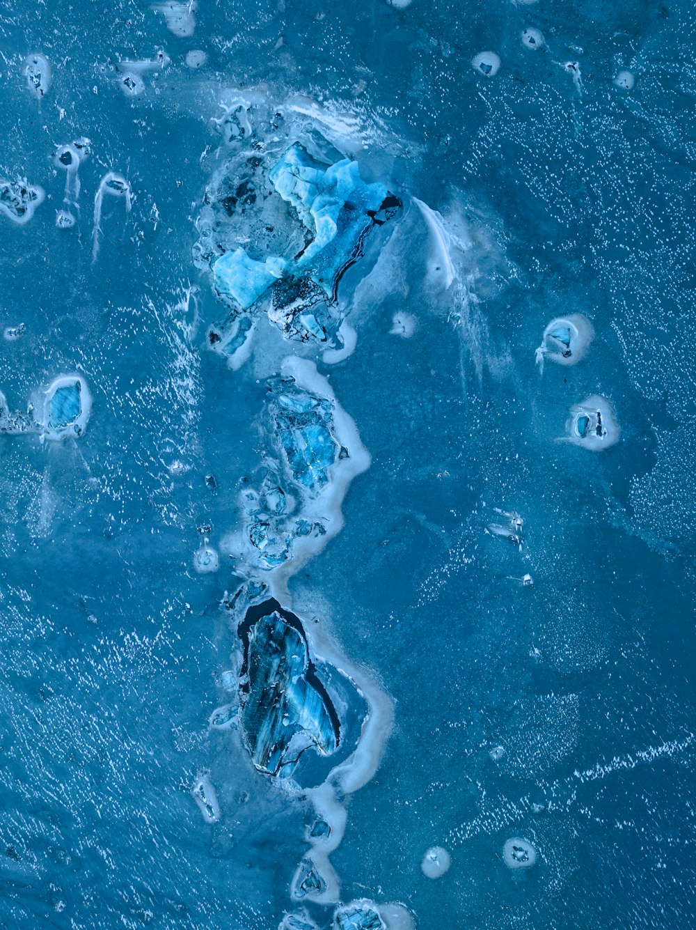 an aerial view of ice and water