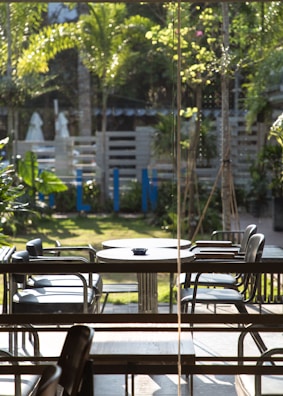 A peaceful outdoor area with plants and relaxation seating.