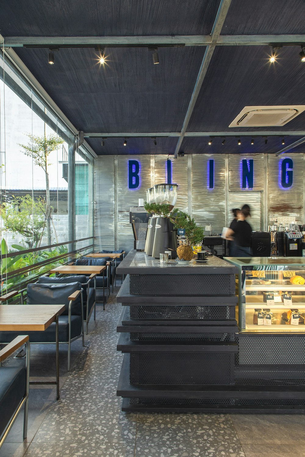 a restaurant with tables and chairs and a bar