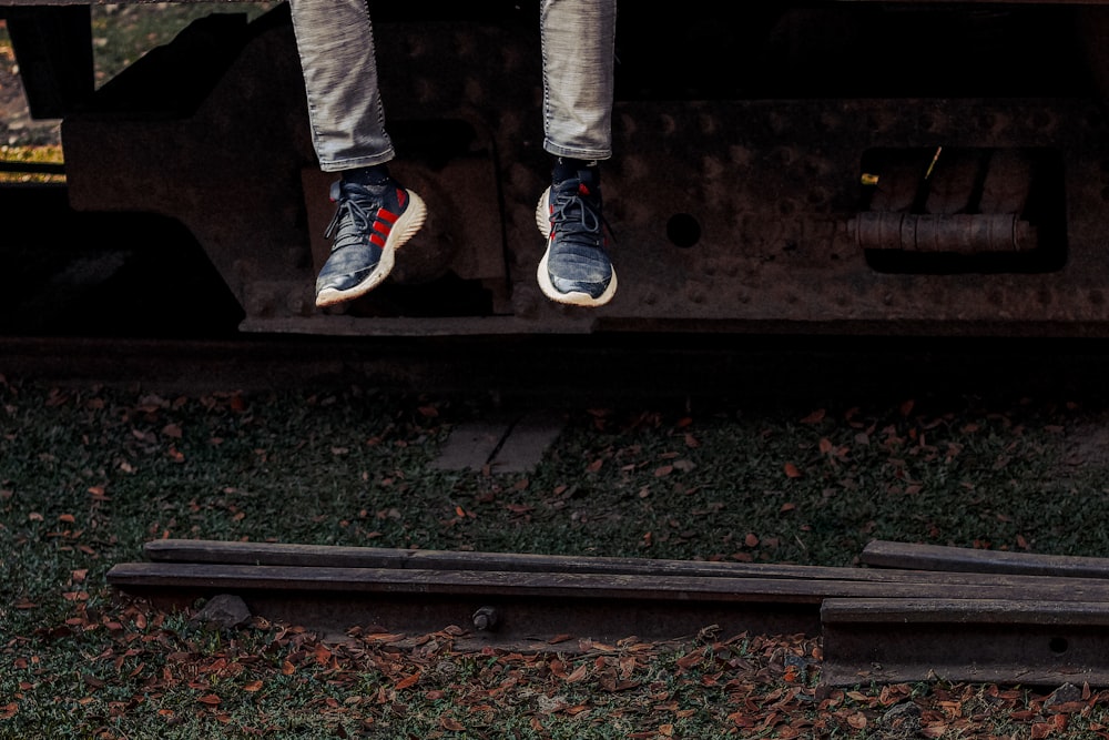 a person jumping off of a train car