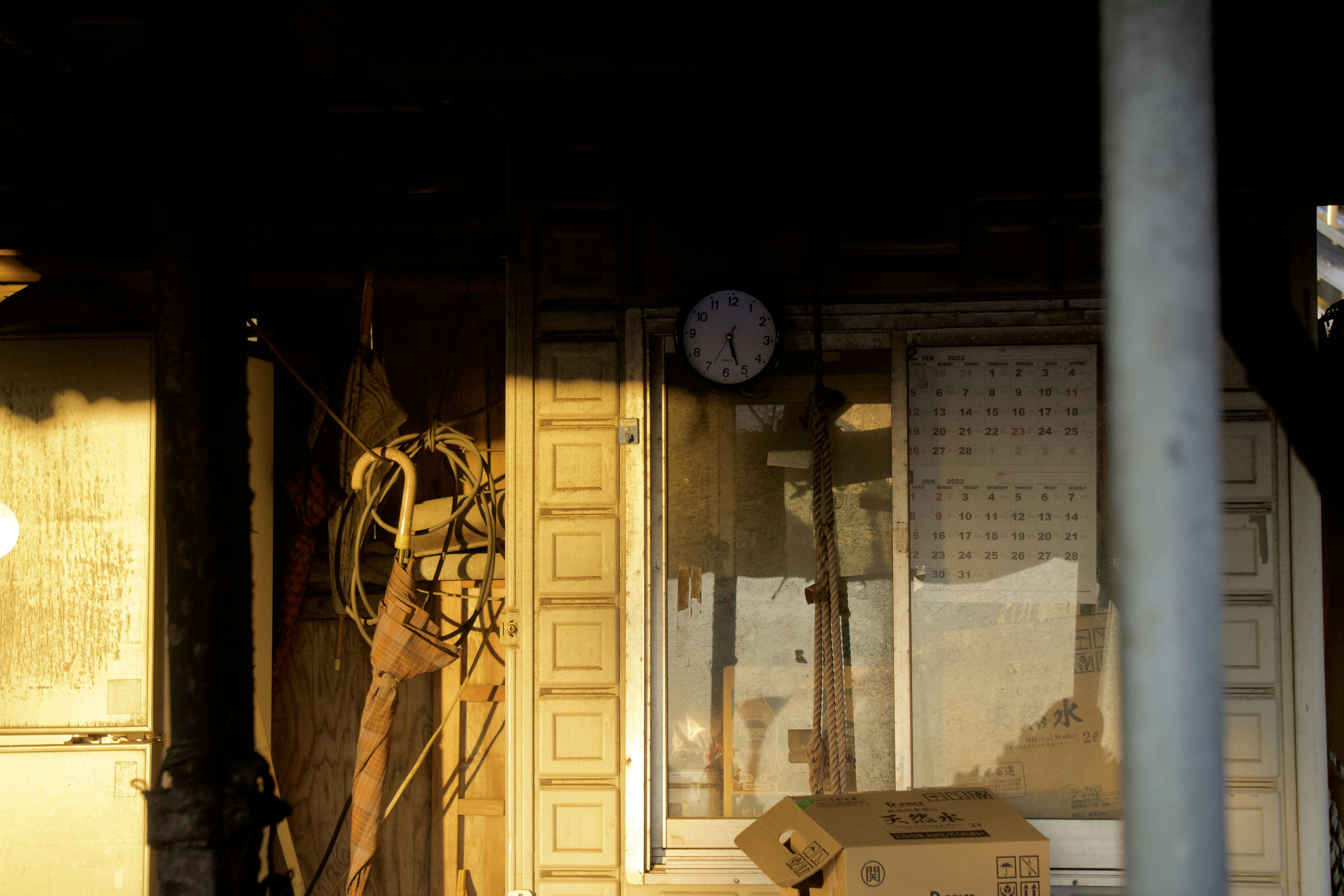 a room with boxes and a clock on the wall