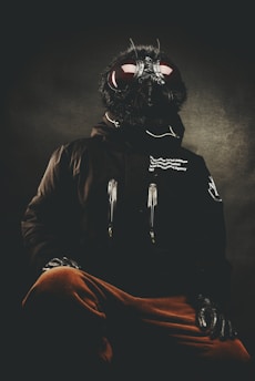 A bold, quirky illustration of a horsefly wearing a business suit buzzing around a corporate boardroom table.