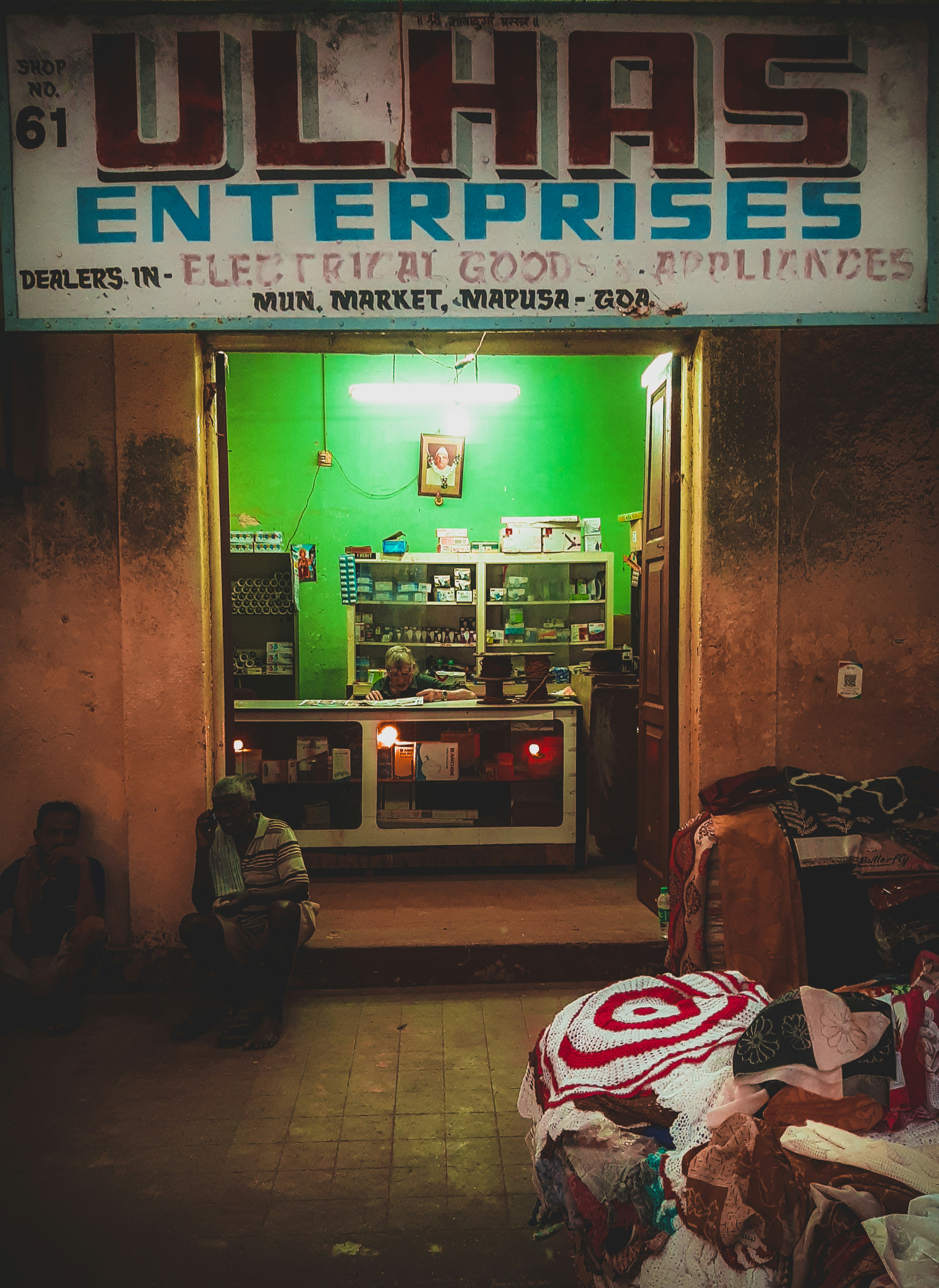 Small business owner at counter in bright modern shop