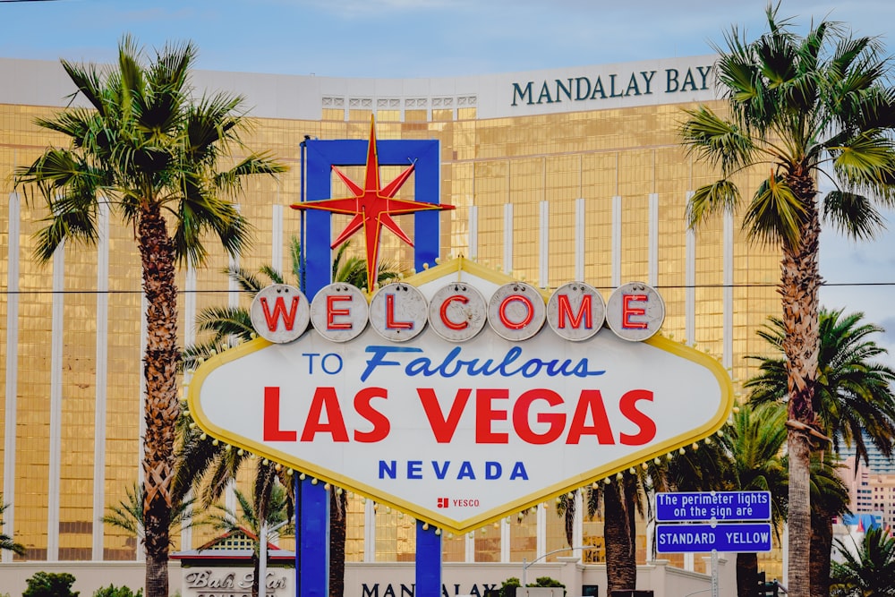 a welcome sign in front of a hotel