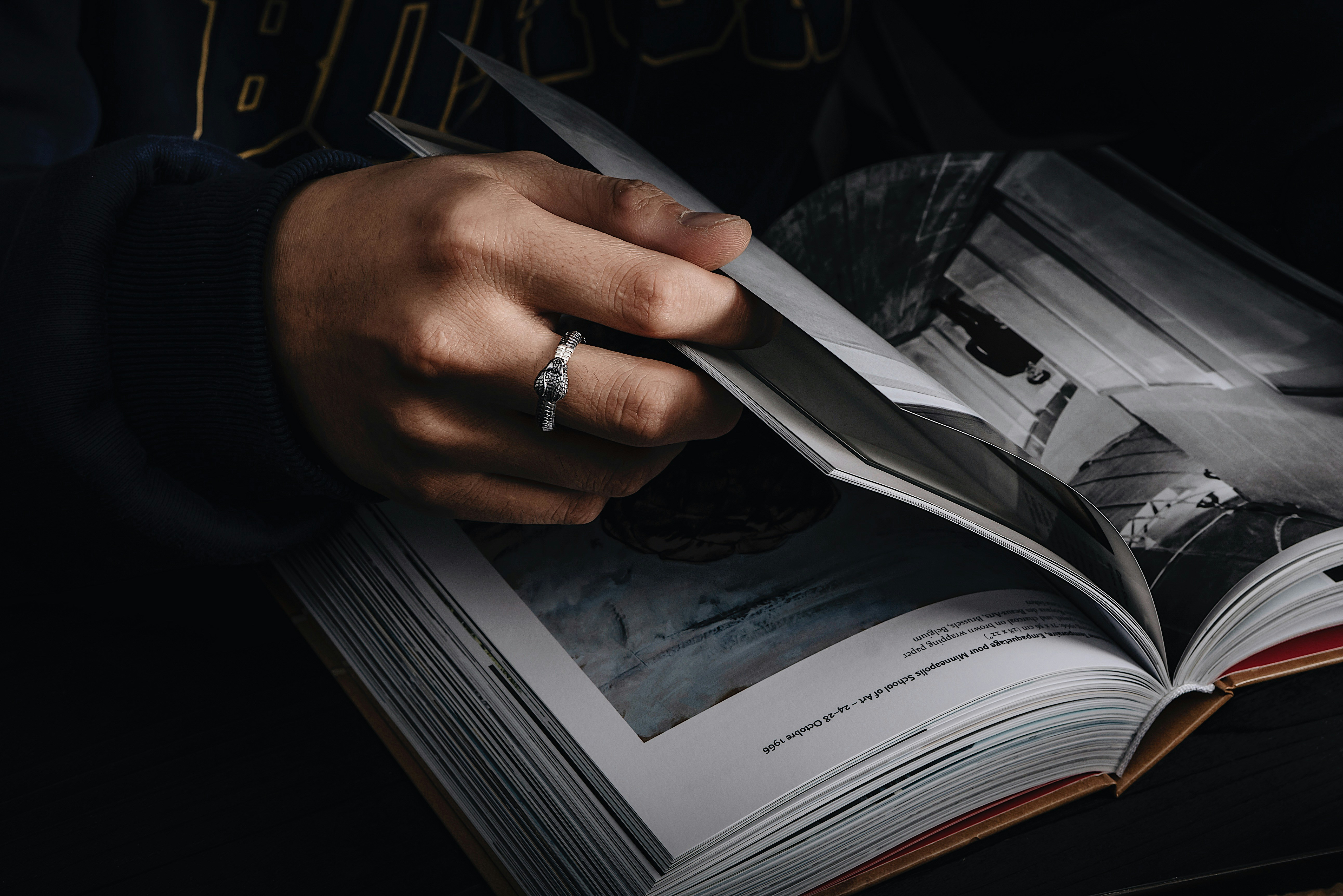 A group of diverse Indian school children (class 7-9 age) intently reading NCERT textbooks in a bright classroom, with a teacher assisting one of them.