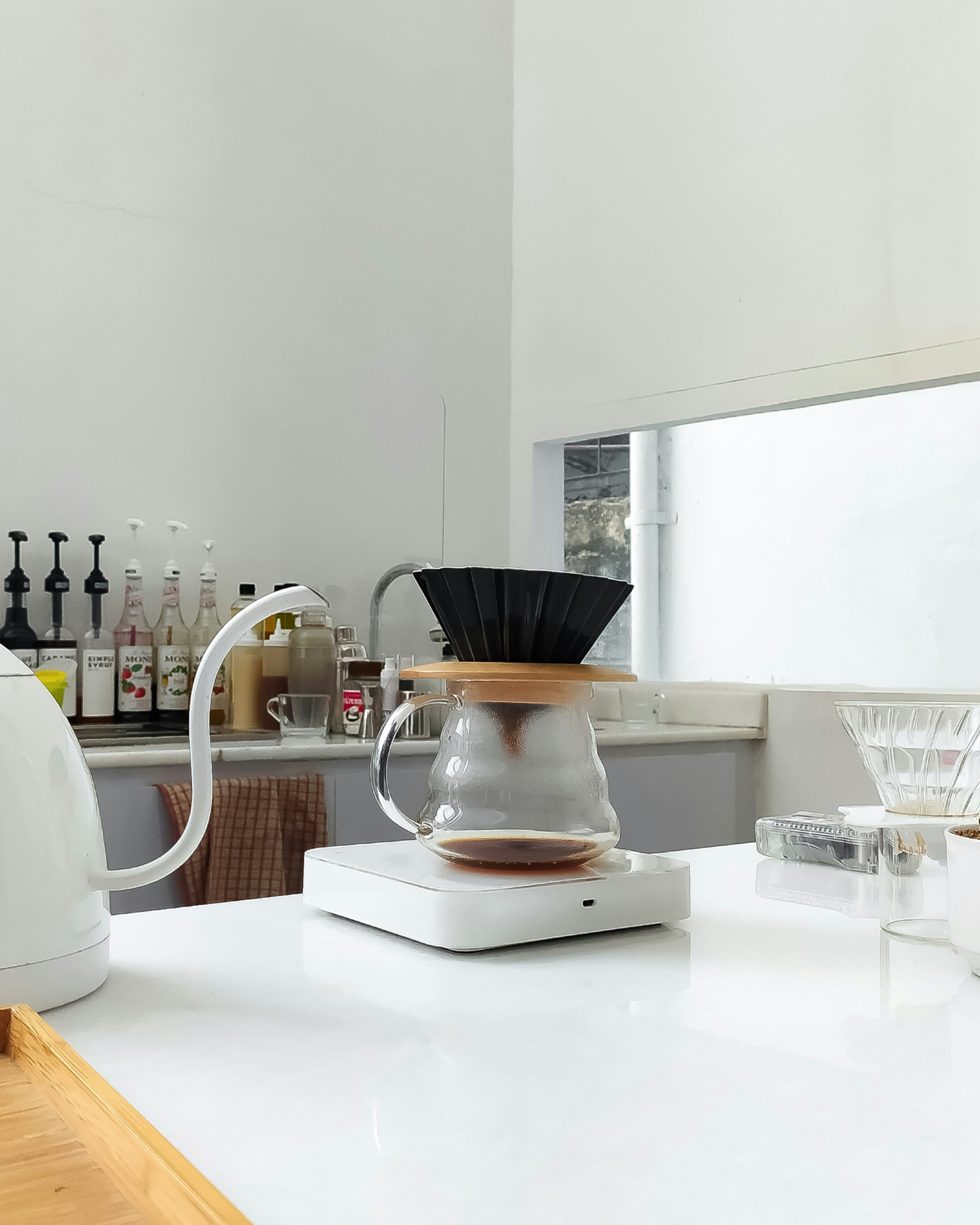 a coffee maker sitting on top of a white counter