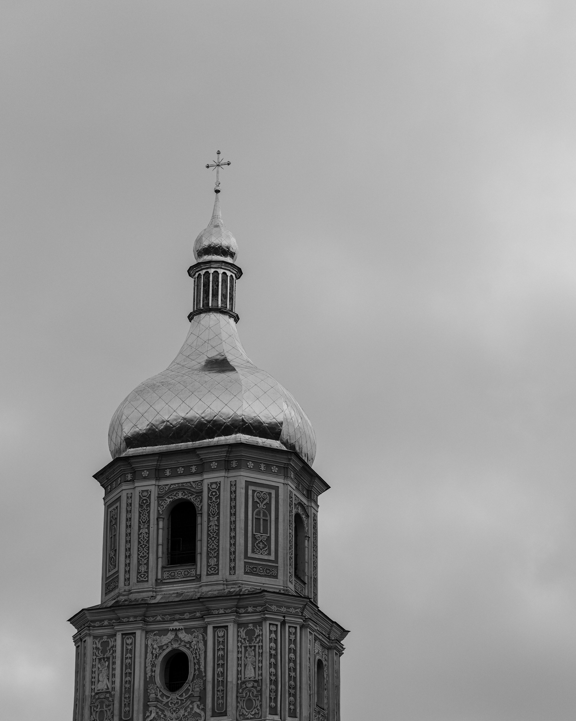 a black and white photo of a clock tower