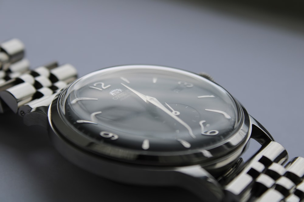 a close up of a watch on a table