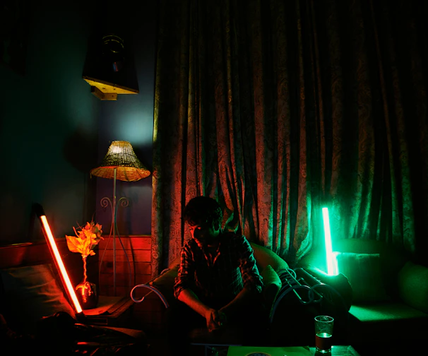 Mood lighting setup with customizable neon decor glowing softly around a private theatre room.