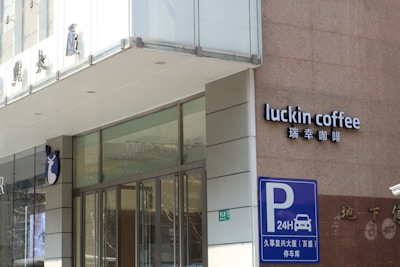 a building with a sign that says luckin coffee