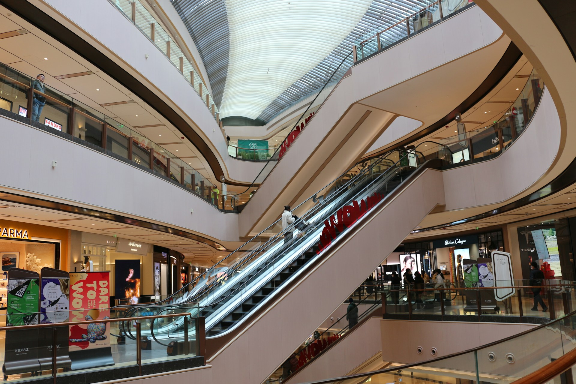 an escalator in a shopping mall with a train on it