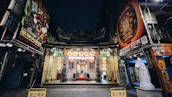 A welcoming entrance to the lodge adorned with traditional Buddhist symbols.