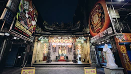 A welcoming entrance to the lodge adorned with traditional Buddhist symbols.