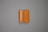 A tan leather wallet is placed on a plain gray surface. The wallet features white stitching along the edges and has a flap closure.
