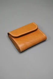 A neatly packaged leather wallet ready for free delivery.