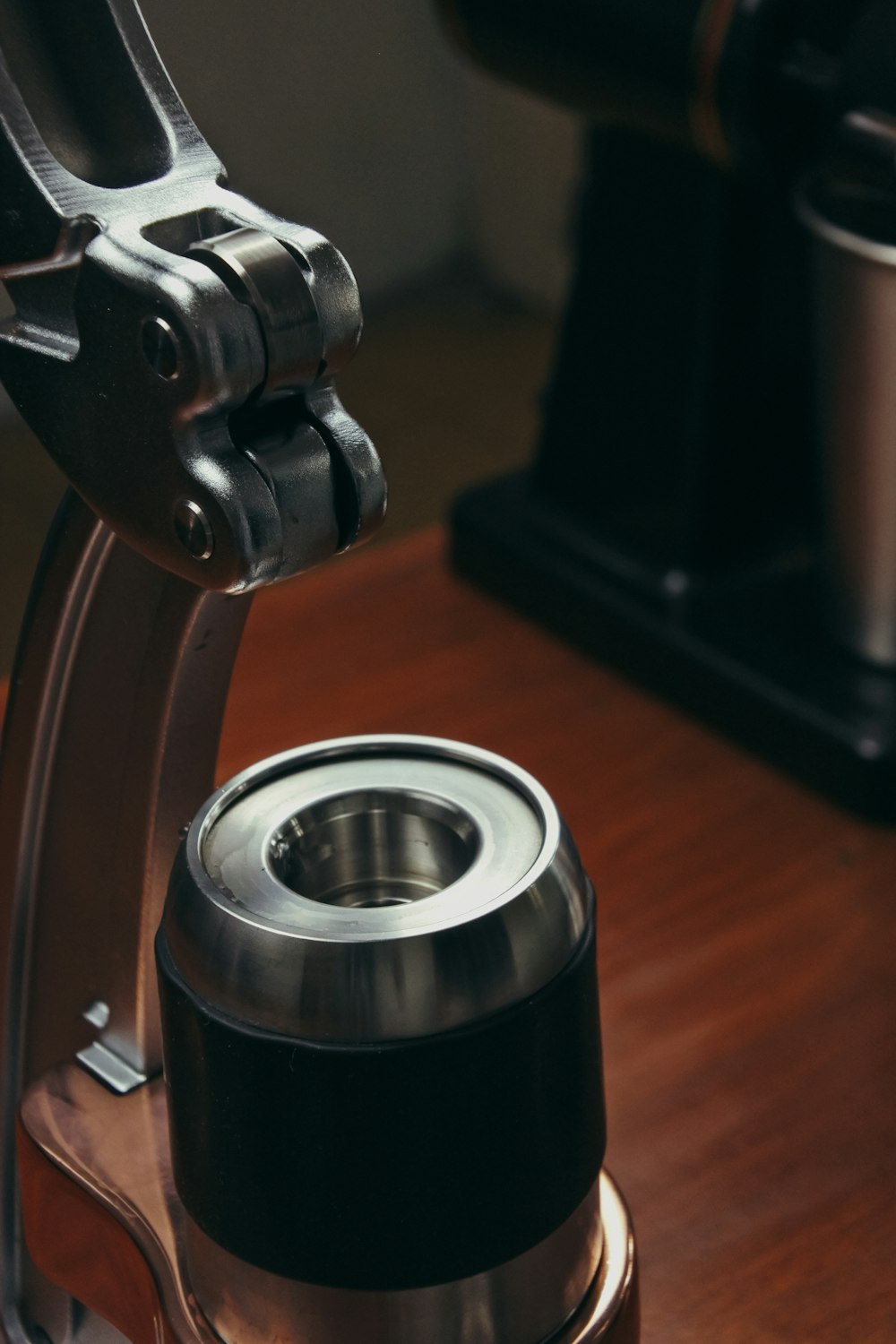 a coffee maker sitting on top of a wooden table