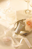 Artfully arranged beauty products with soft lighting highlighting textures and colors