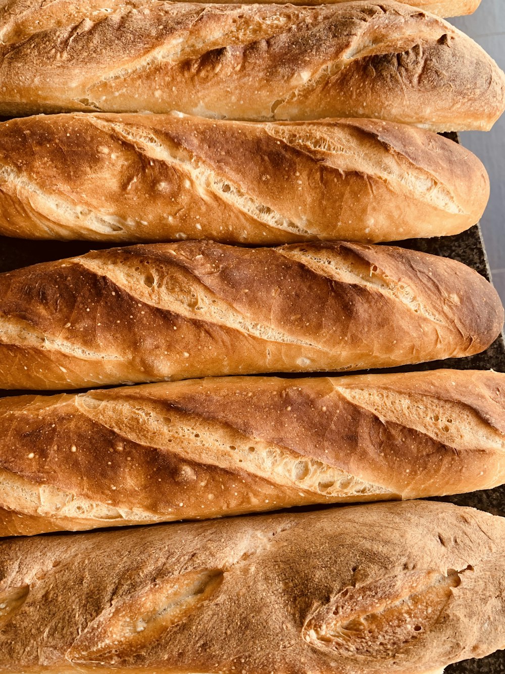 a close up of a bunch of bread loaves