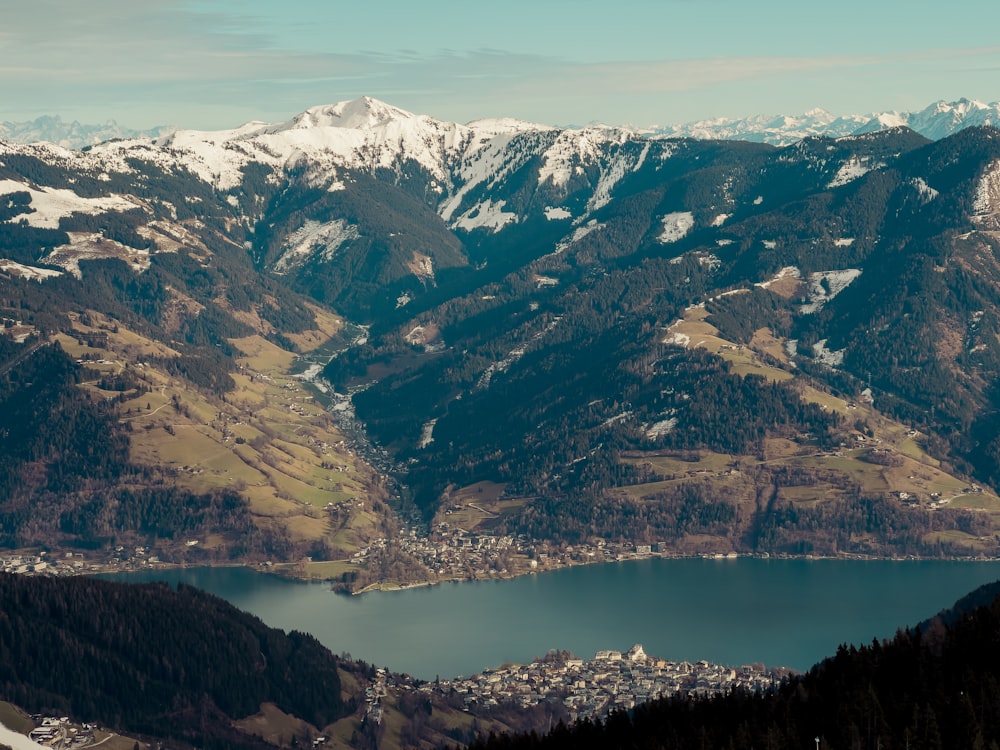 a view of a mountain range with a lake in the foreground