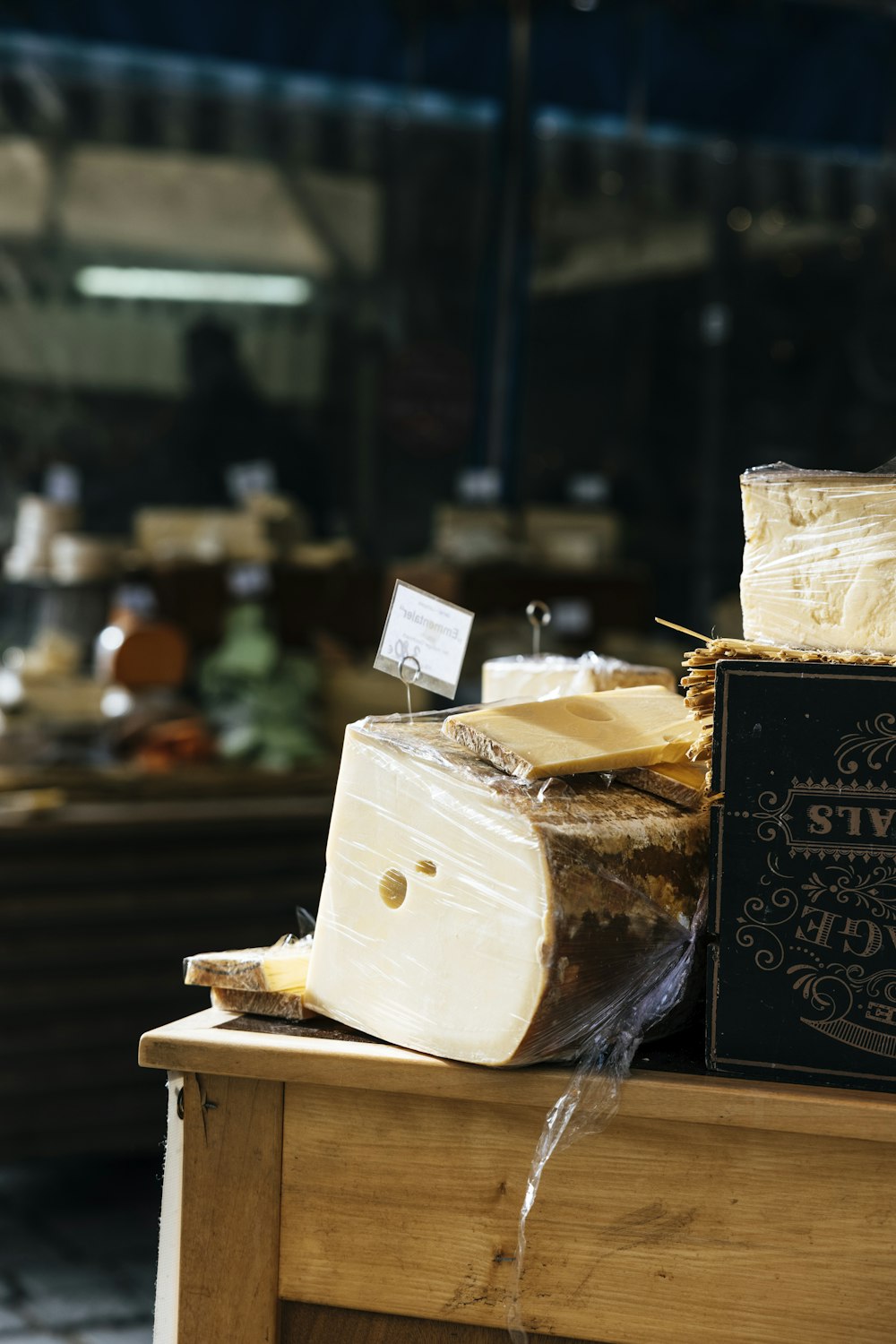 a wooden table topped with lots of cheese