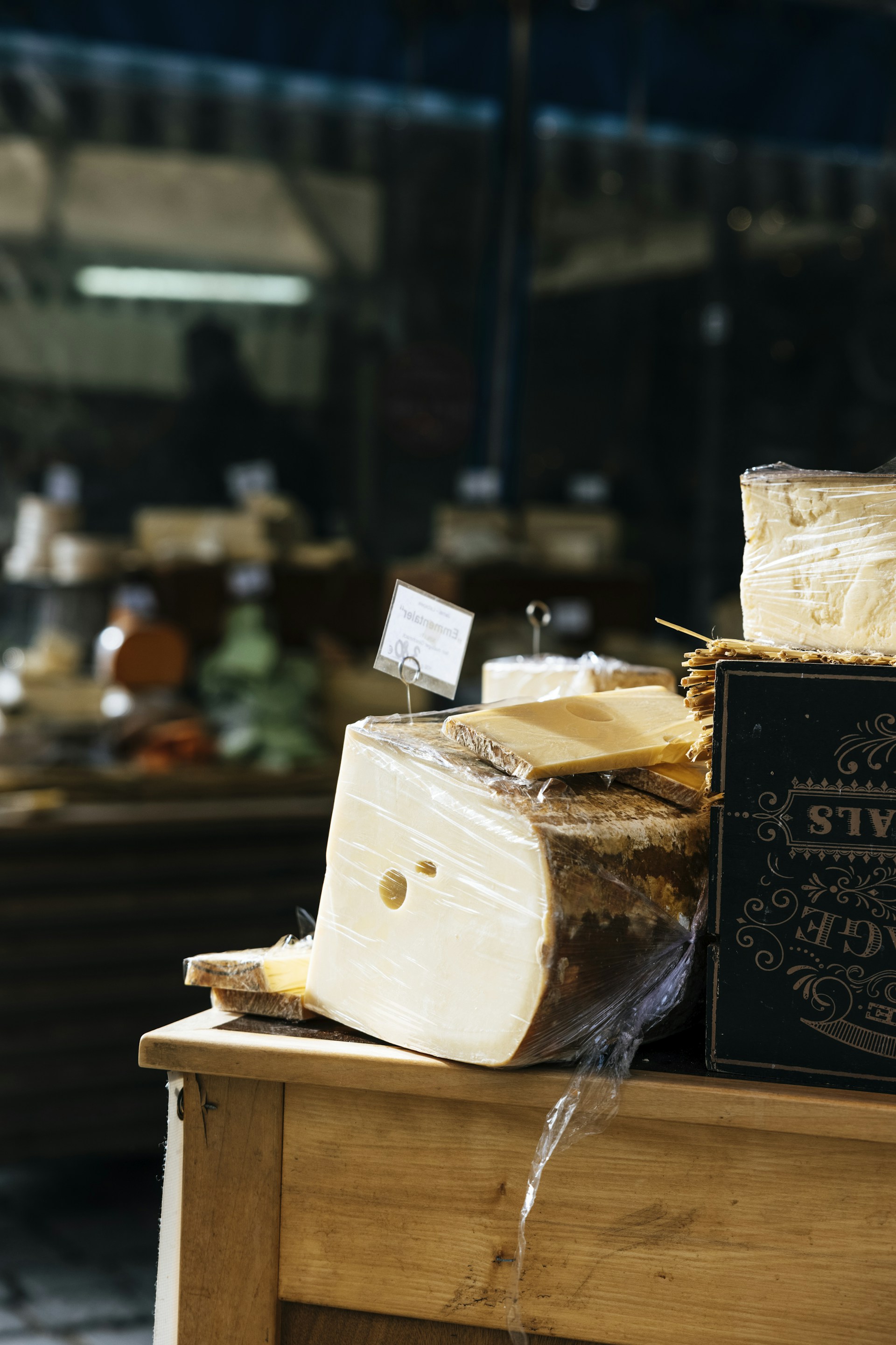 a wooden table topped with lots of cheese