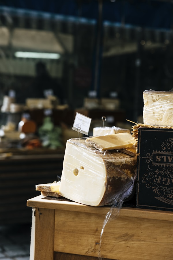 A wooden table topped with lots of cheese