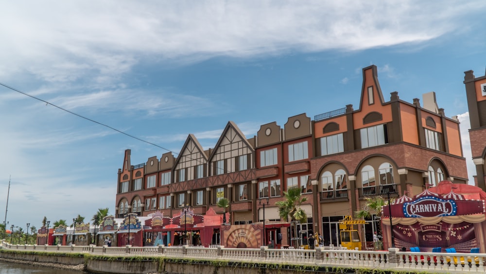 a row of buildings next to a body of water