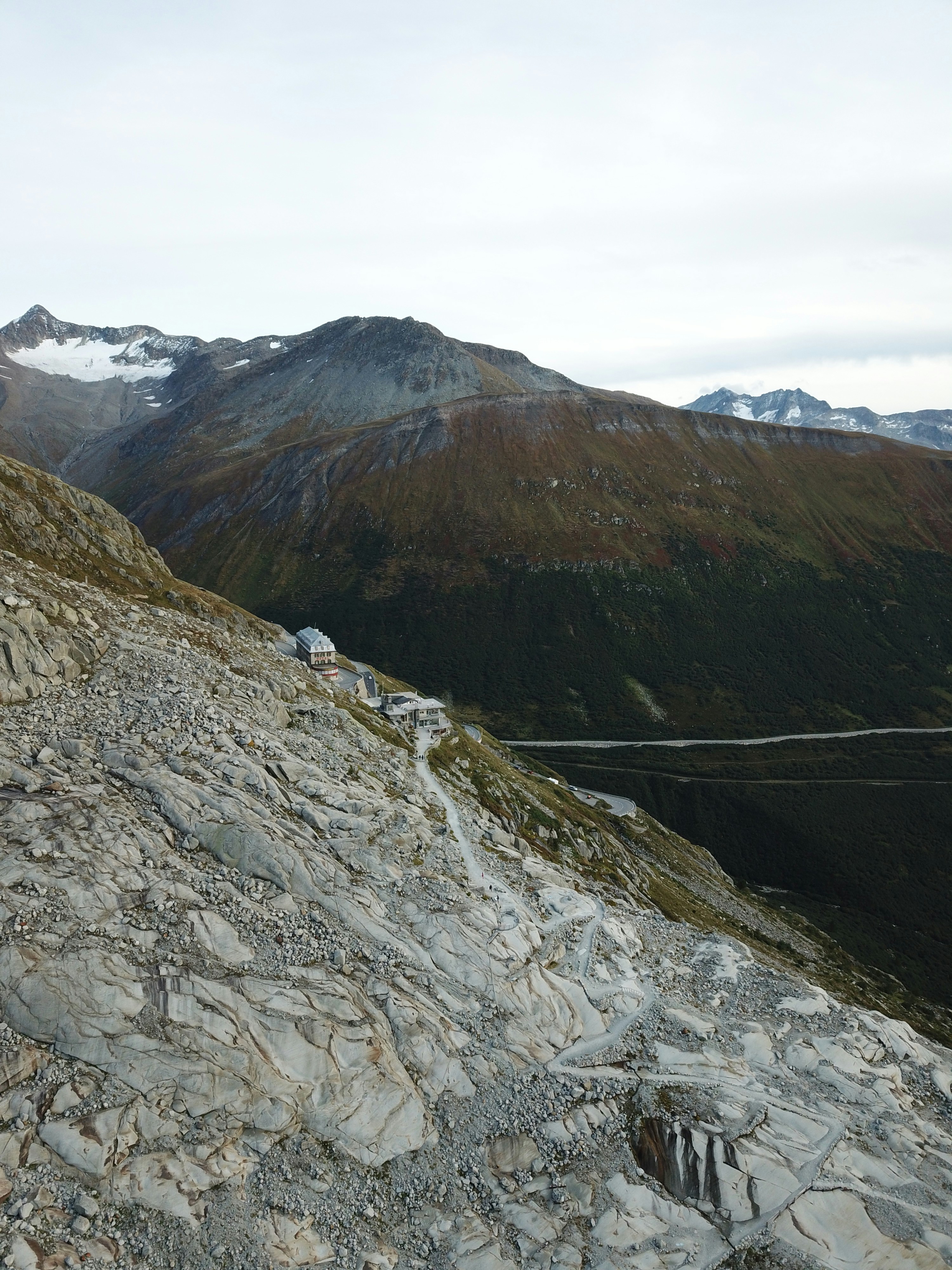 a view of a rocky mountain with a cable running through it
