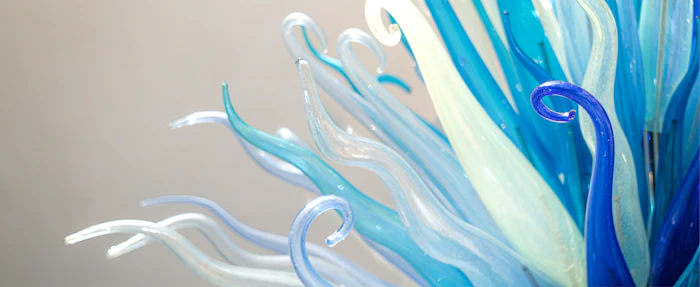 Close detail of teal and white blown glass strands
