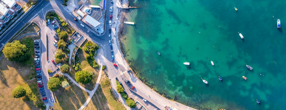 an aerial view of a body of water with boats in it