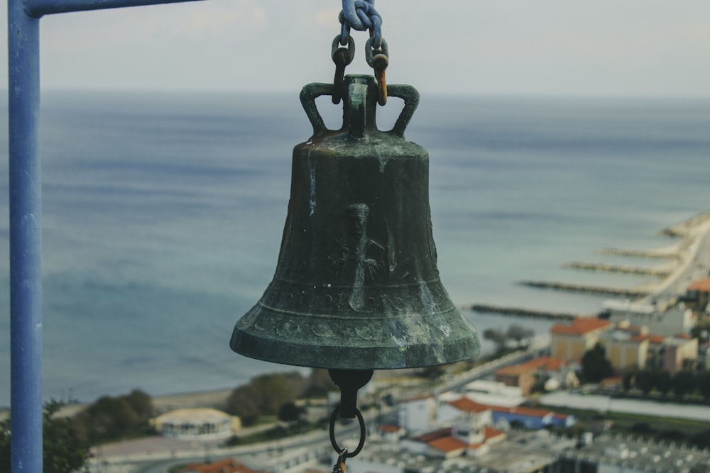 a bell hanging from the side of a building