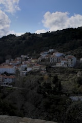 A cozy pixel-art village bustling with quirky characters and colorful buildings.