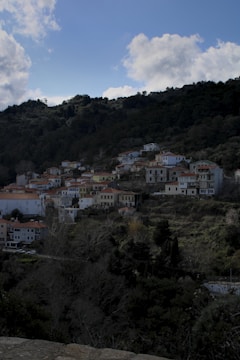 A cozy pixel-art village bustling with quirky characters and colorful buildings.