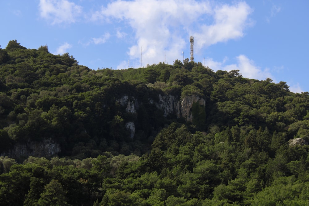 a hill with a radio tower on top of it