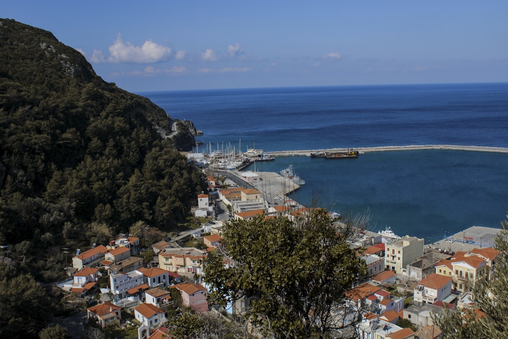 a view of a small town next to a body of water