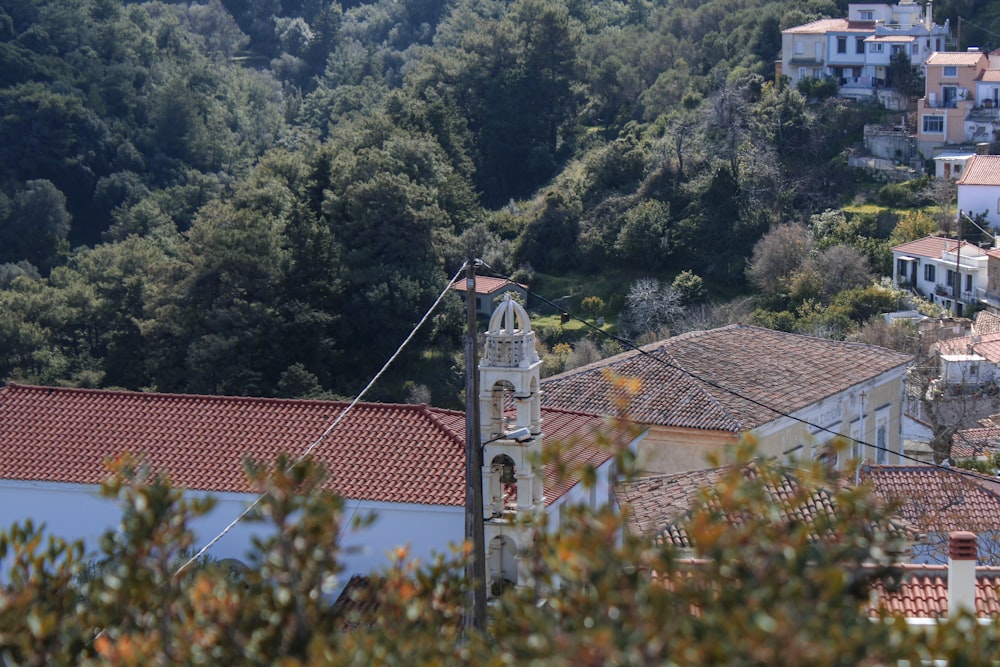 a view of a village with a clock tower