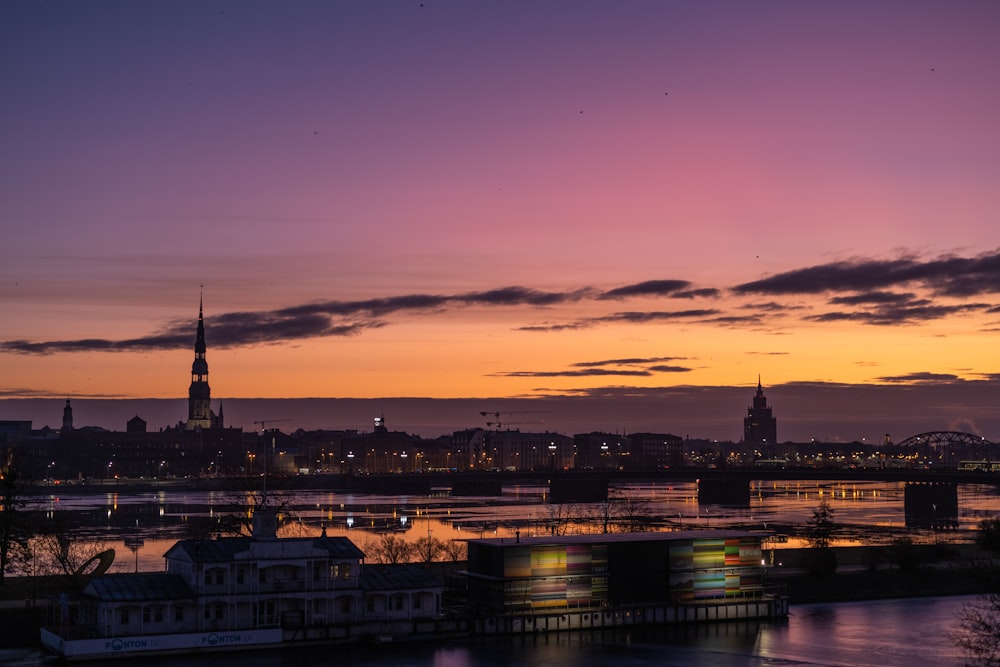 a sunset view of a city and a river