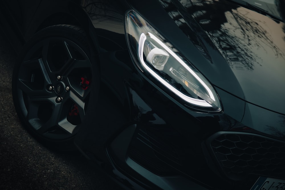 a close up of a black sports car