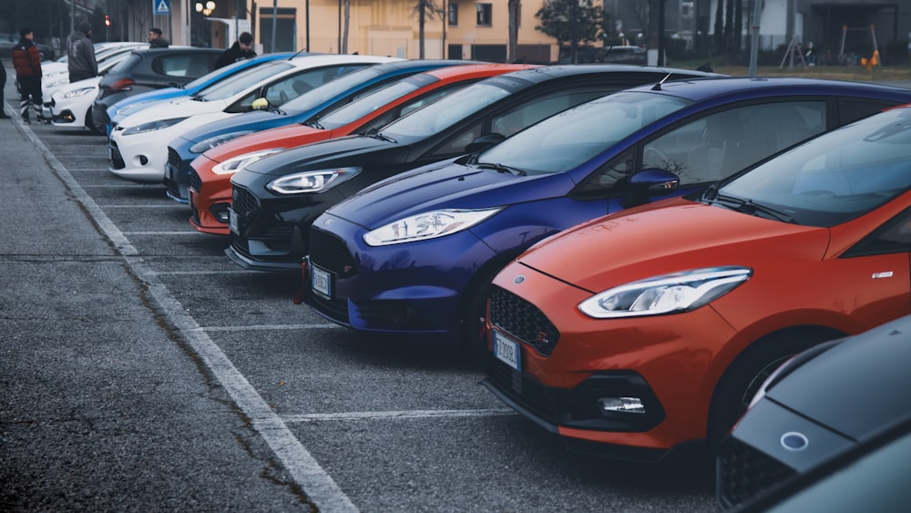 a row of cars parked in a parking lot