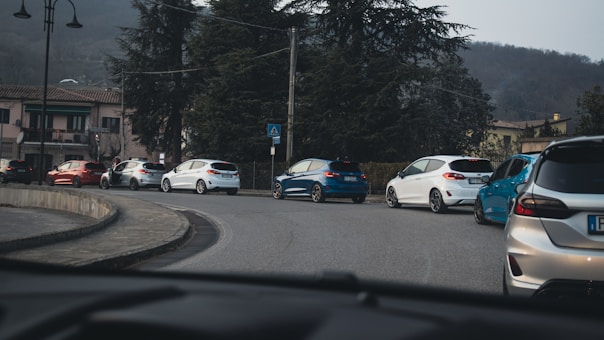 a group of cars parked on the side of a road