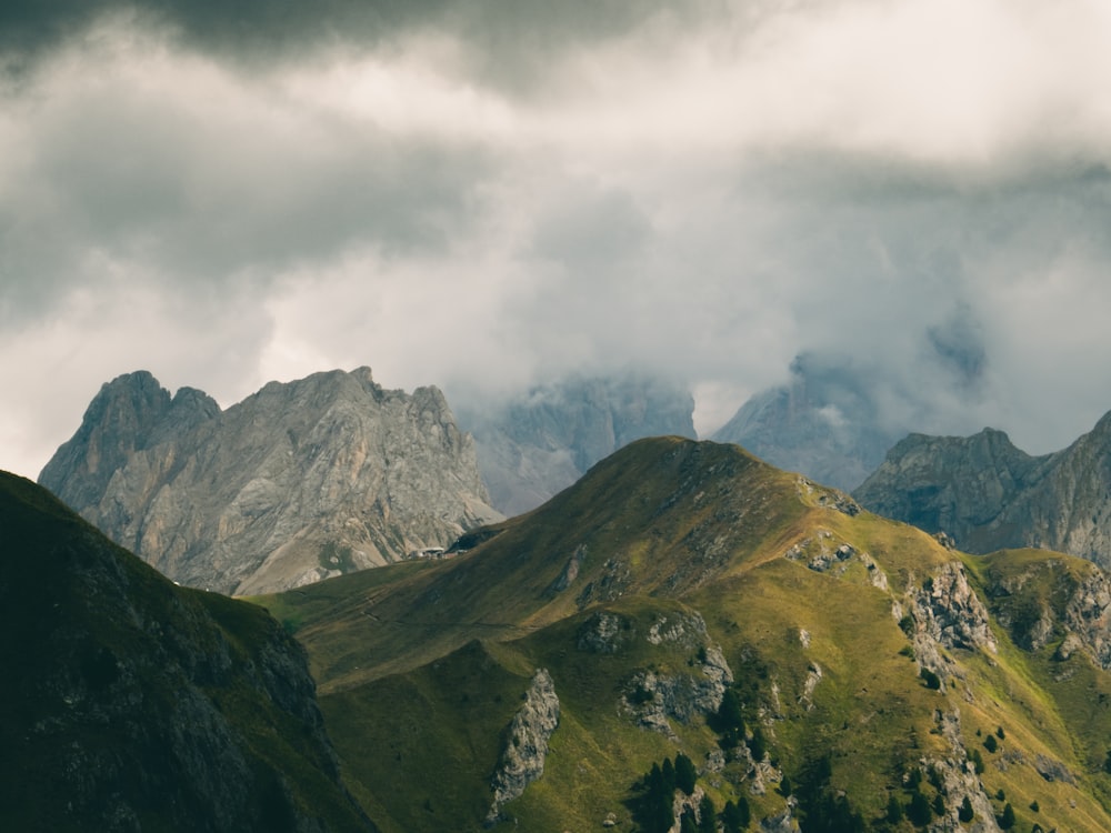 a view of a mountain range under a cloudy sky