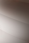 Gentle curves form subtle, layered patterns, creating an abstract and minimalist aesthetic.
