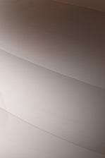 Gentle curves form subtle, layered patterns, creating an abstract and minimalist aesthetic.
