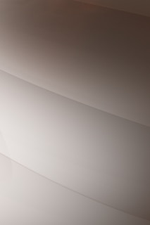 Gentle curves form subtle, layered patterns, creating an abstract and minimalist aesthetic.