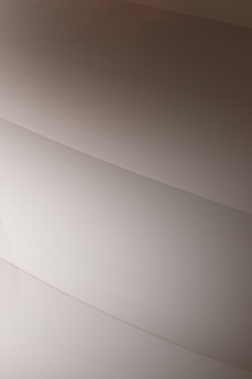 Gentle curves form subtle, layered patterns, creating an abstract and minimalist aesthetic.