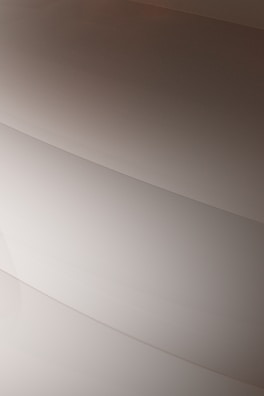 Gentle curves form subtle, layered patterns, creating an abstract and minimalist aesthetic.
