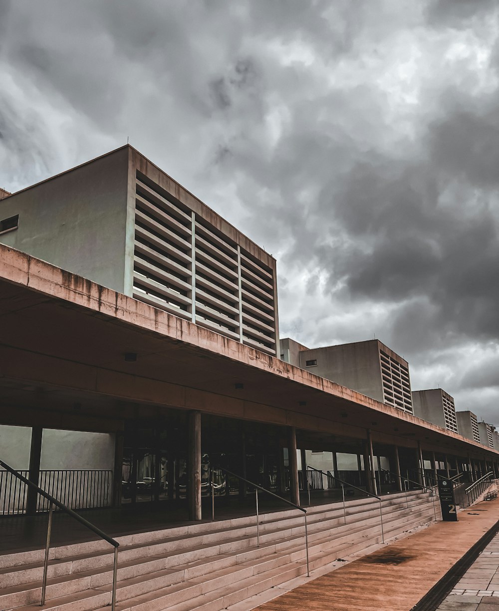 a large building sitting under a cloudy sky