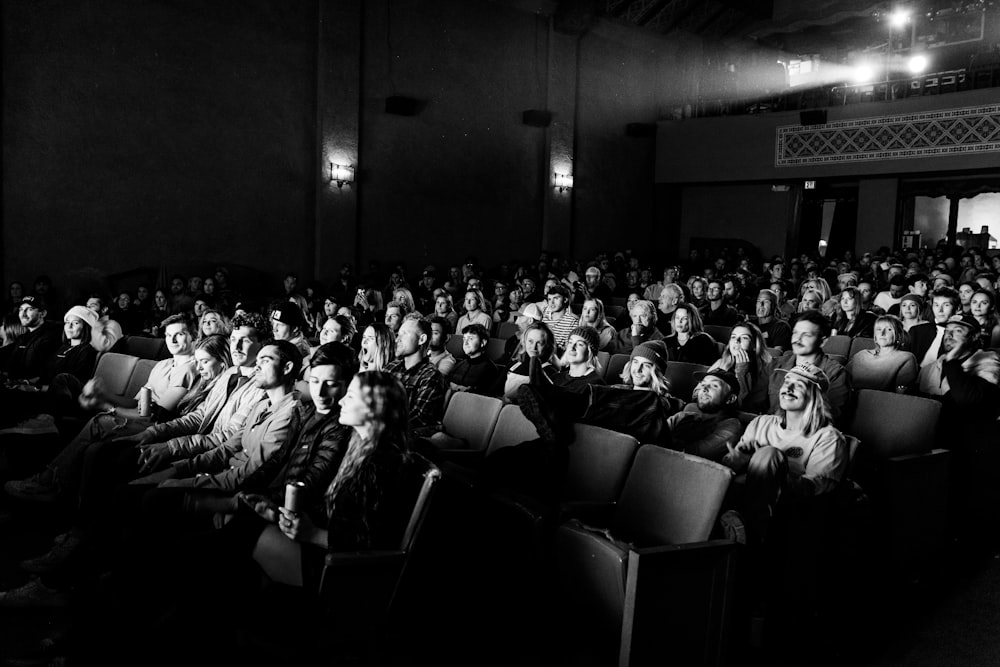 a black and white photo of a crowd of people