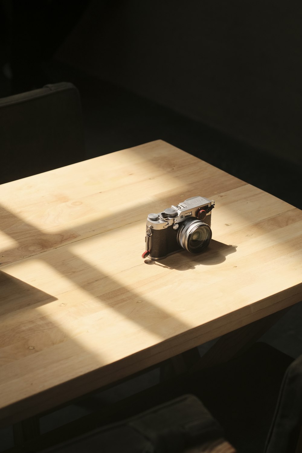 a camera sitting on top of a wooden table