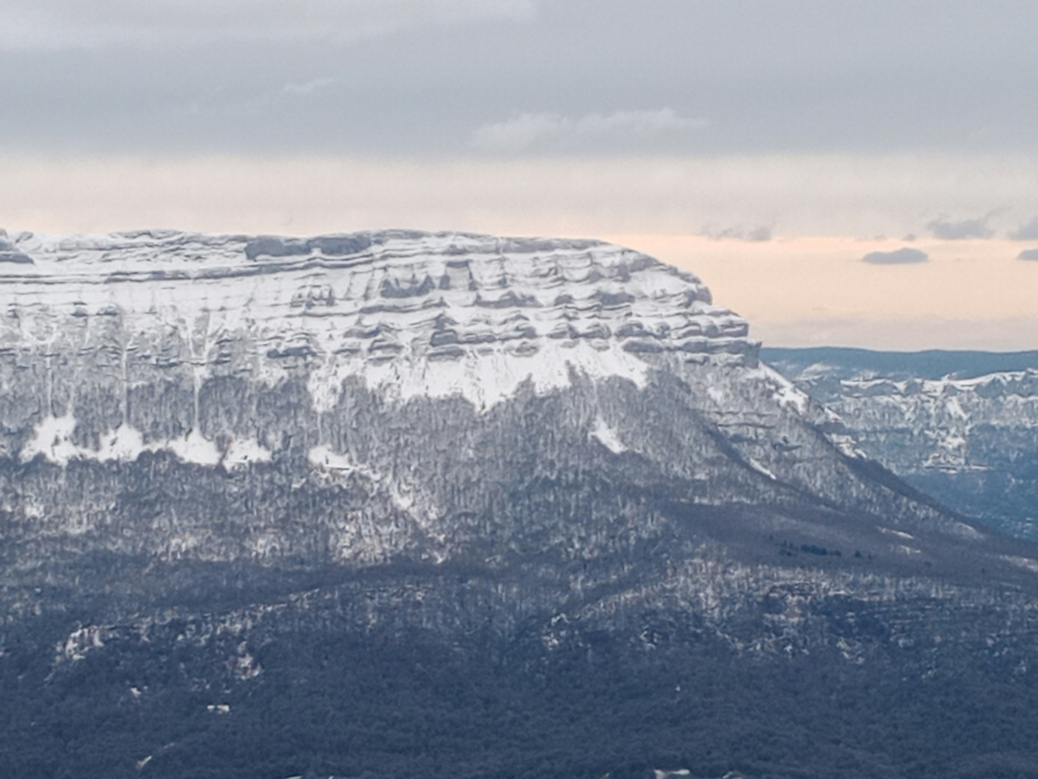 a view of a mountain with snow on it